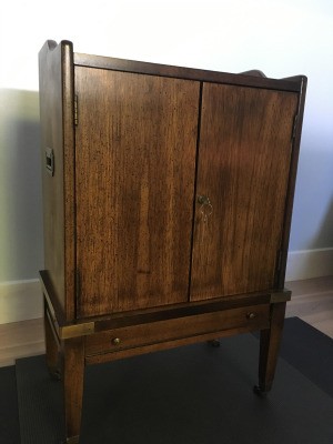 Value of a Brandt Cabinet - dark wood two door cabinet with a bottom shallow drawer