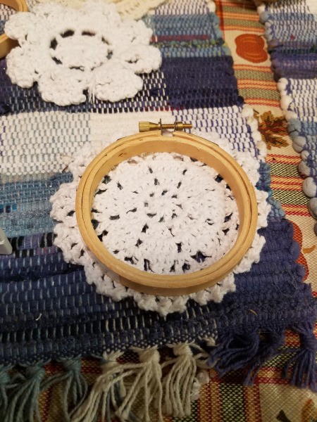 Embroidery Hoop Doily Wall Decoration - hoop sitting on top of a different commercial doily
