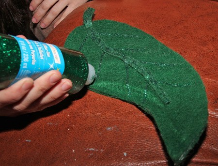 Little Shop of Horrors Costumes - adding veins to large leaves with glitter glue