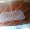 Value of a Teak Table - table with a mattress reflected in it