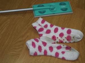 Two old socks and a Swiffer floor cleaner.