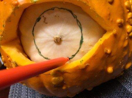 Spooky Double Pumpkin Eyeball - replace white pumpkin with the smooth side out, draw a circle for the pupil