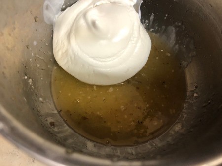 mixing sugar & orange juice for frosting