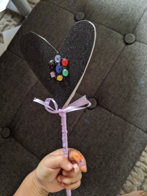 Fancy Costume Wand - child's hand holding the lavender wand