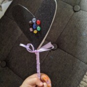 Fancy Costume Wand - child's hand holding the lavender wand