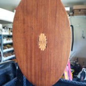 Value of a Vintage Flip Top Table- oval table with inlay medallion in the center