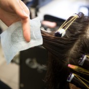 Woman Getting a Perm With Curls in Hair