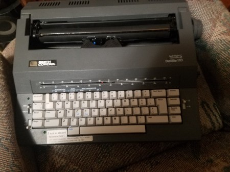 A grey Smith Corona electric typewriter