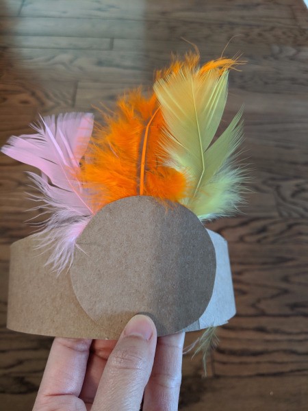 Recycled Cardboard Turkey Hat - tape feather array to the back of the circle