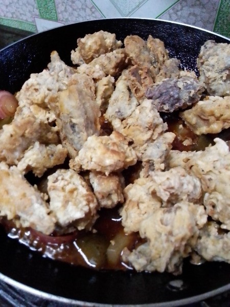 pork pieces added to sauce