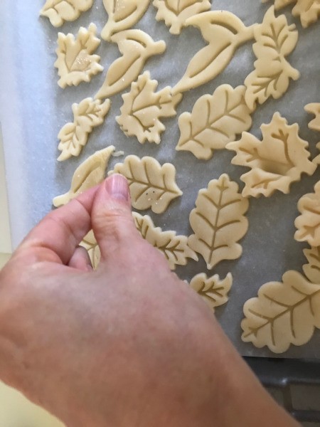 sprinkling Soup Crackers with seasoning
