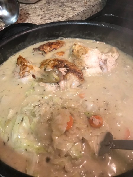 chicken in pan with soup