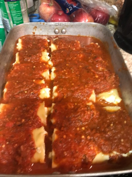 sauce on Lasagna Roll Ups in pan