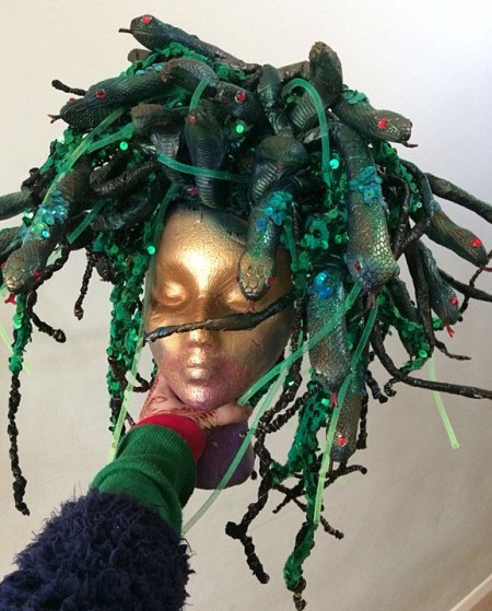 A Medusa wig in green with lights.