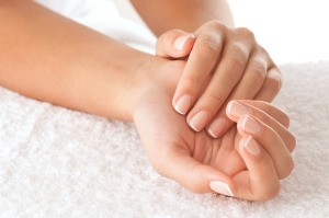 Woman's hands with natural manicured nails.