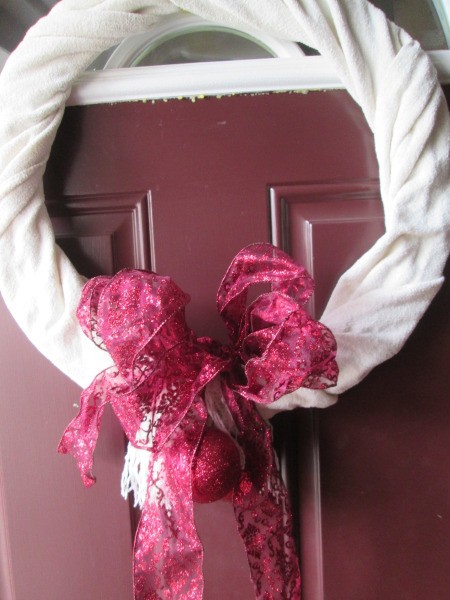 Using Winter Scarf As Wreath Cover - fluffy white scarf wreath with red metallic bow