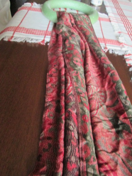 Making Winter Scarf Covered Wreaths - red and green print scarf looped over foam wreath form