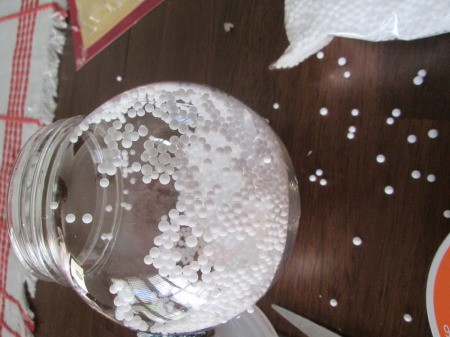 Budget Friendly Snow Globe - adding snow