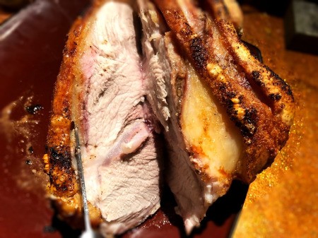 slicing Pork Roast with Crispy Crackling