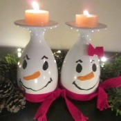 Drinking Glass Candle Holders - snowpeople with lit candles