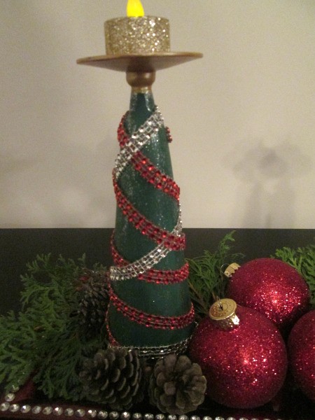 Christmas Tree Candle Holder - closeup of one of the finished trees with greenery and two glittery red ornaments creating an arrangement