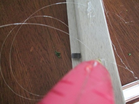 Moss Trim Picture Frame Wreath - gluing strings in place