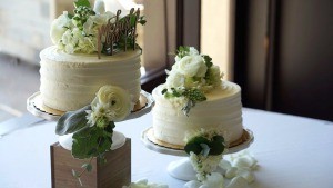 Adding Fresh Flowers to Cake Decoration - two small wedding cakes decorated with fresh flowers