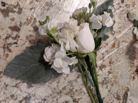 Adding Fresh Flowers to Cake Decoration - closeup of one cluster of flowers
