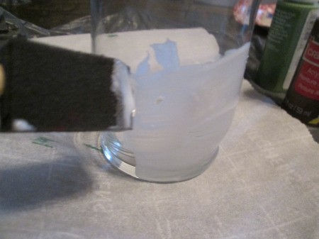 DIY Stained Glass Candle Holder - applying mixture to outside of candle holder with a foam brush