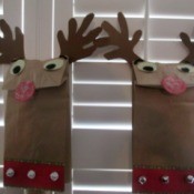 Reindeer Puppets - puppets against wooden blinds