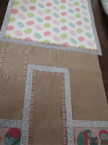 Gingerbread House Gift Bags - paper glued to the bag and washi tape around the roof and closeup of door and lower edge trim
