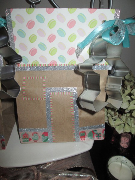 Gingerbread House Gift Bags - tied with a blue ribbon with a cookie cutter attached