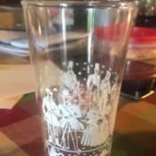 Identifying Drinking Glasses - clear glasses with white design of people in Victorian attire with a band of coffee pots and other images around the bottom