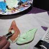 Painting the elf ears a light green.