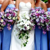 Bride and bridesmaids holding flowers.
