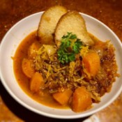 Spaghetti Squash Soup in bowl with bread