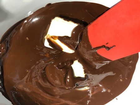 adding butter to brownies