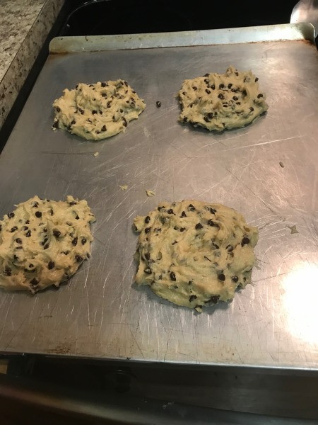 putting Chocolate Chip Cookies on baking sheet