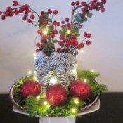 Pine Cone Vase - white pine cone vase with fairy lights turned on
