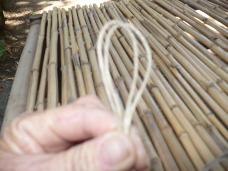 Repairing A Bamboo Coffee Table - cut jute 6x the length of the table top, to start lashing the poles down