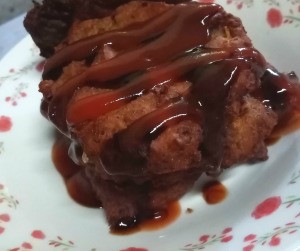 leftover fish patties drizzled with sauce on plate