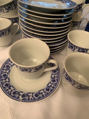 Value of Tea Cups and Saucers - white cups and saucers with blue trim pattern