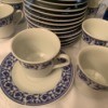 Value of Tea Cups and Saucers - white cups and saucers with blue trim pattern