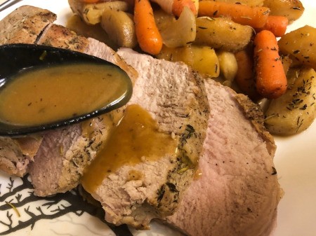 spooning Honey Mustard sauce on Pork Loin