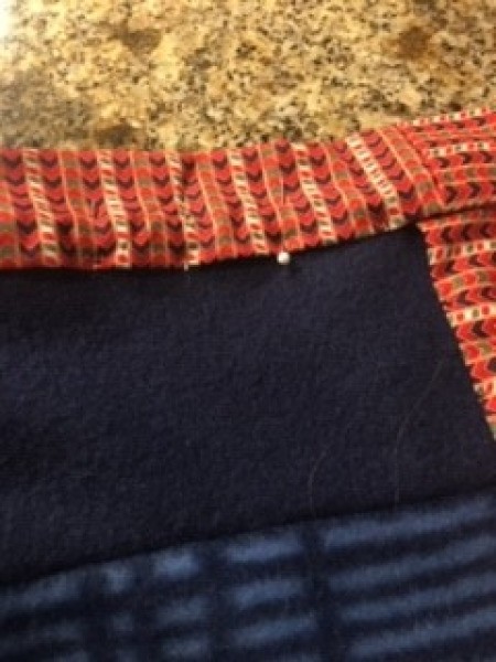 Scrap Quilt for a Baby Boy - binding pinned and then blind stitched