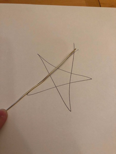 DIY Wire Star Christmas Tree Topper - begin following the template and bend wire