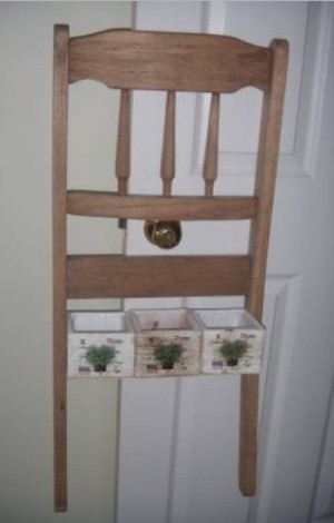 Recycled Chair Back as Decorative Rack/Planter - chair back with planters attached between legs, hanging on a doorknob
