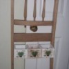 Recycled Chair Back as Decorative Rack/Planter - chair back with planters attached between legs, hanging on a doorknob