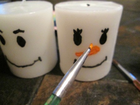 Designing Two For One - painting the nose on the snowwoman