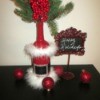 Santa Vase And Lamp - greenery added to bottle to use as a vase, displayed with a sign saying Happy Holidays and some Christmas ornaments
